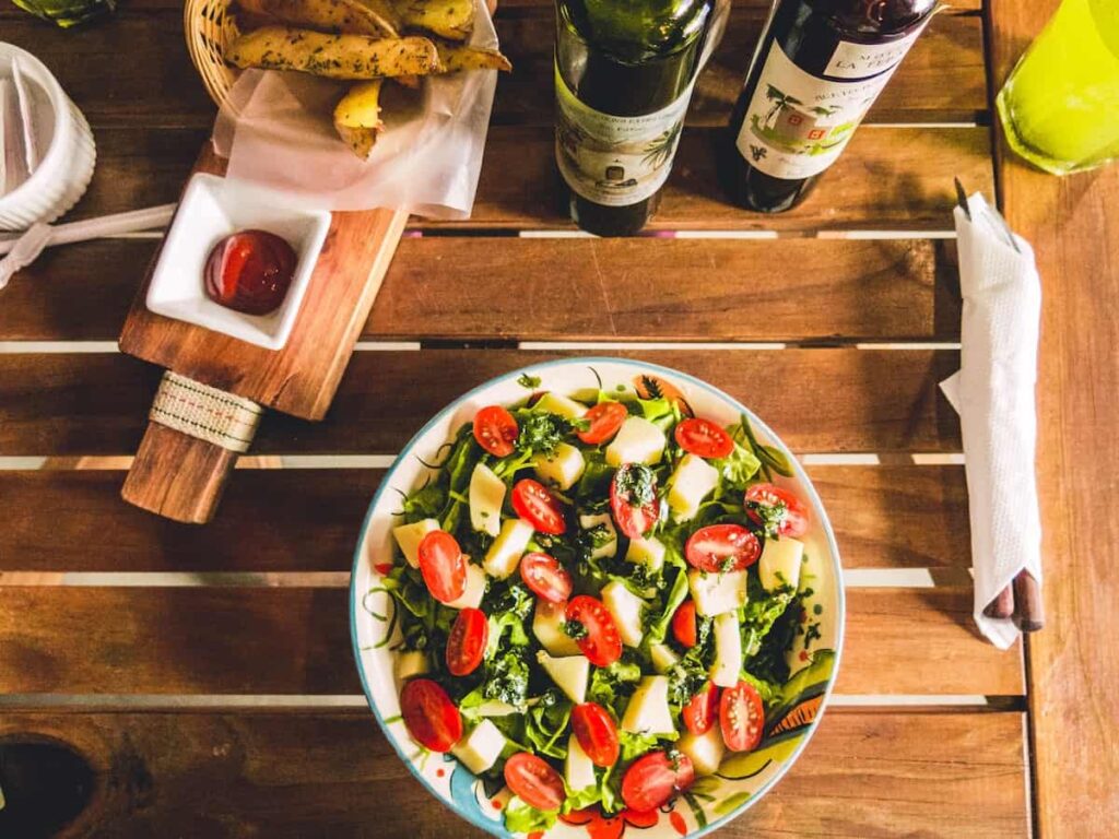 10 best supplements to balance hormones for women image of: mediterranean salad in bowl and olive oil
