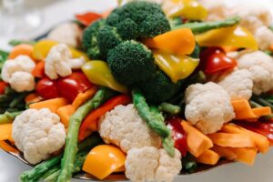 fat loss for for a female image of vegetables in and around a bowl