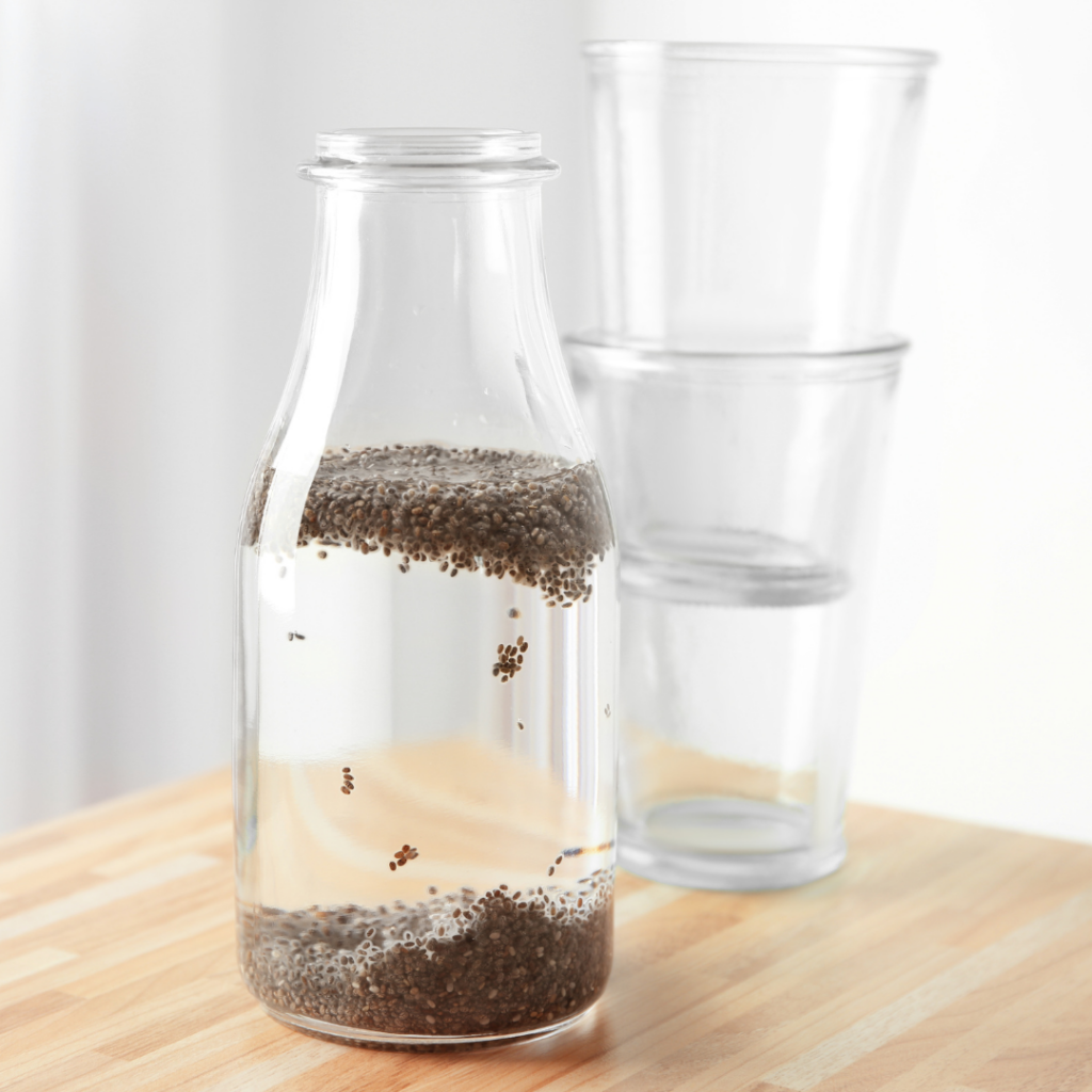 benefits of chia seeds in water image of chia seeds in water with two cups stacked 