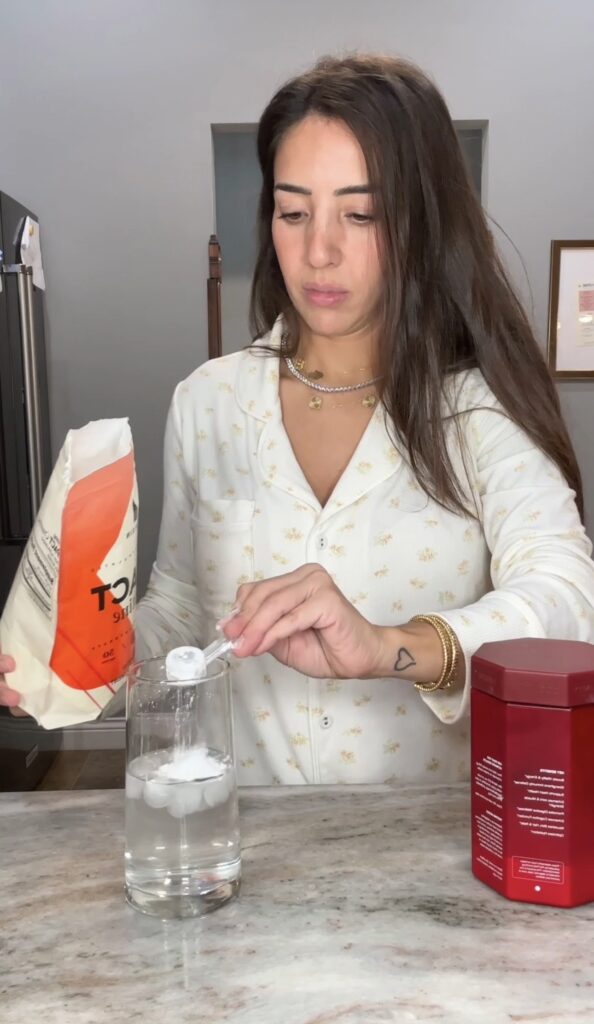 woman taking creatine supplement for fitness and strength.