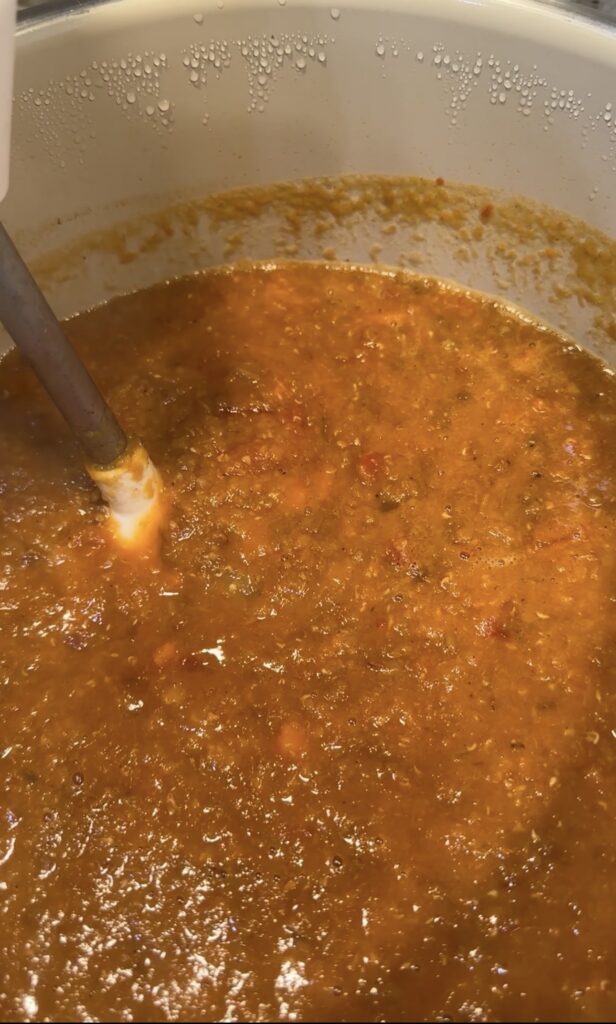 Hearty Lentil Vegetable Soup with carrots, greens, and warm spices, perfect for healthy Sunday meal prep