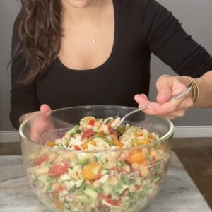 High-protein Mediterranean dense bean pasta salad with vegetables and feta