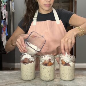 High protein peaches and cream chia pudding topped with cinnamon peaches and coconut flakes.