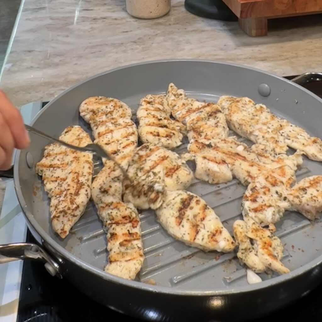Protein pasta and seasoned chicken for chicken Caesar pasta salad